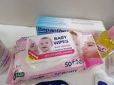 a lot of baby wipes and other items on the counter