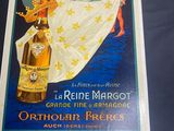 framed poster of a woman holding a bottle of beer