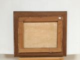 an image of a picture frame sitting on top of a piece of wood