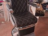 a barber chair in the middle of a salon