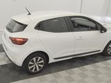 the rear end of a white car parked in a garage