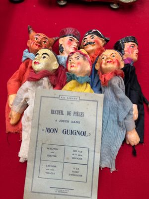 a bunch of dolls that are sitting on a table
