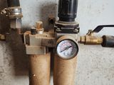 a close up of a water meter with a gauge attached to it