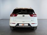 the rear end of a white suv parked in a garage