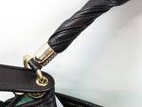 a close up of a purse with a handle on it