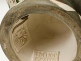 a close up of a vase with flowers on it