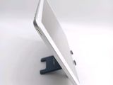 a white tablet computer sitting on top of a stand