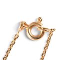 an image of a close up of a gold chain with a ring on it