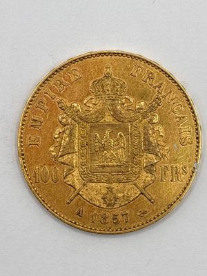 a close up of a gold coin with a coat of arms on it