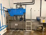 a picture of a large blue container in a room