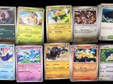 several pokemon cards are lined up on a black surface