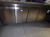 a stainless steel dishwasher in the corner of a kitchen