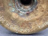 a close up of a metal object with writing on it