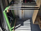 a picture of a garage with a rack of skis on it