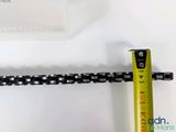 someone is measuring the length of a chain with a tape measure