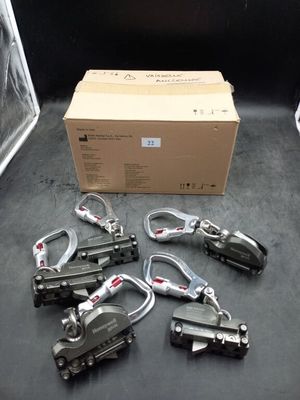 a lot of clamps that are sitting on the floor
