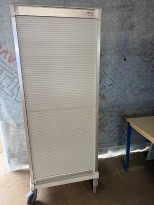 an image of a white cabinet in a room