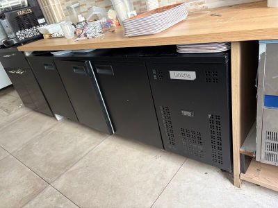 a refrigerator and a refrigerator freezer sitting on a counter