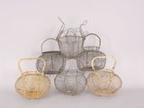 four baskets are stacked on top of each other on a white surface