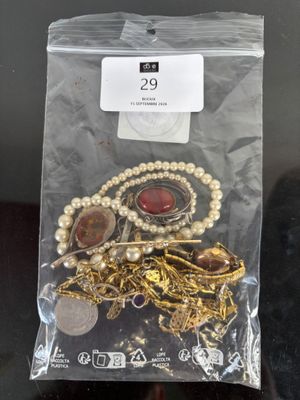 a bag of jewelry that is sitting on a table