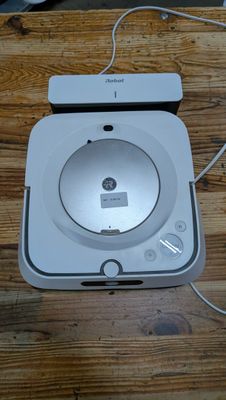 a wii game system sitting on a wooden table