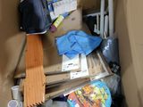 a cardboard box filled with assorted items in it