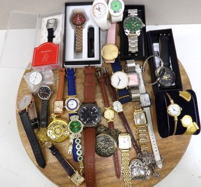 a wooden tray with a bunch of watches on it