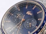 a close up of a wrist watch with a blue face