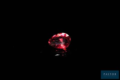 a red diamond on a black background