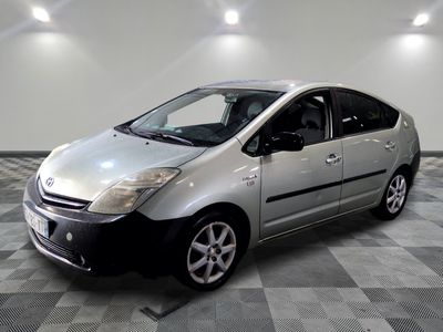 a picture of a silver car parked in a garage