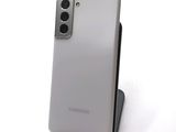 the back of a white samsung galaxy s20 with a camera on top of it