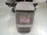 an image of a welding helmet sitting on the floor