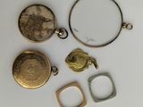 three gold and silver lockes, a ring, and a ring with a picture of a woman ' s face