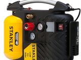 un compresseur d'air noir et jaune sur fond blanc