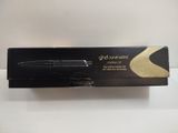 a box with a black pen sitting on top of it