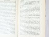 an open book on a table with a white background