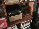 a book shelf with a lot of books on top of it