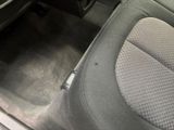 a picture of the inside of a car with the door open