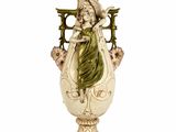 a statue of a woman holding a vase on a white surface