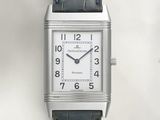 an image of a silver watch with a black leather strap