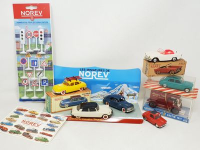 a lot of toy cars that are sitting on a table