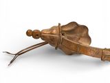 a wooden sculpture of a bug on a white surface