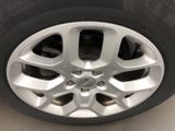 the tire of a car with a flat tire on the side of the road