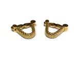 pair of gold tone cufflinks on white background with white background