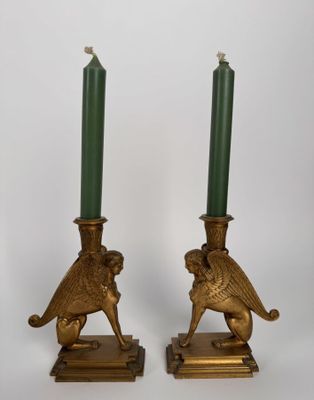 pair of antique brass candles with green candlesticks on stands