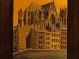 une peinture à l'huile représentant une cathédrale, dans un cadre en bois