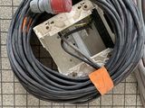 a cord connected to an electrical device on the floor