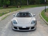 a silver sports car parked on the side of the road