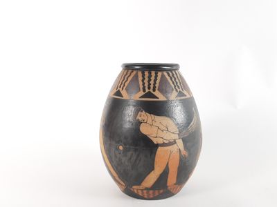 a vase that has a picture of a man playing a game of tennis