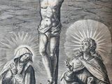 the crucifix of jesus on the cross with two women and a man